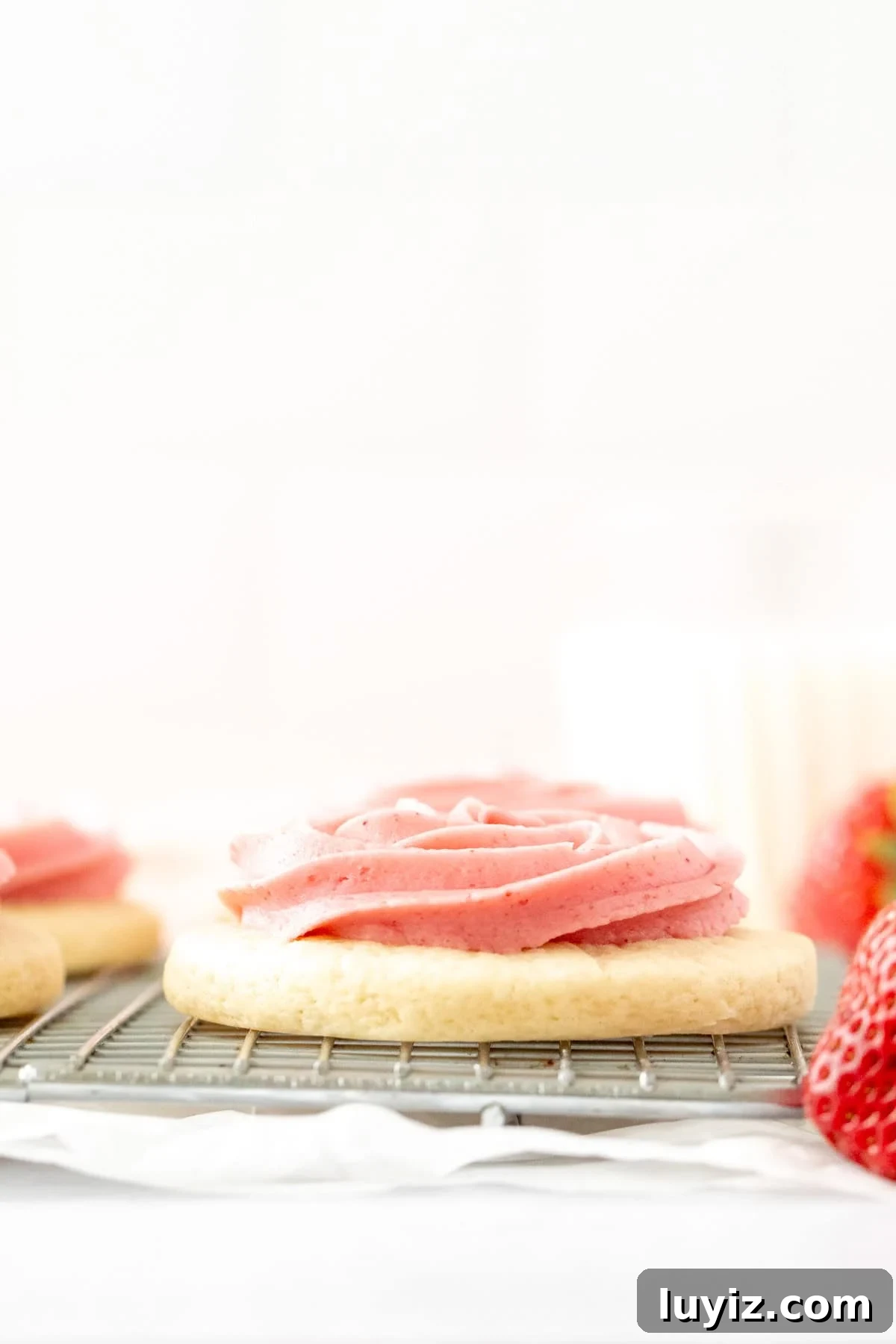 Strawberry Frosted Sugar Cookies Recipe — Soft & Chewy Cookies 3 Cakey sugar cookie piped with strawberry buttercream frosting