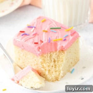 Classic Moist Vanilla Sheet Cake Recipe for Parties and Potlucks 10 Slice of moist vanilla sheet cake cake with bite taken out