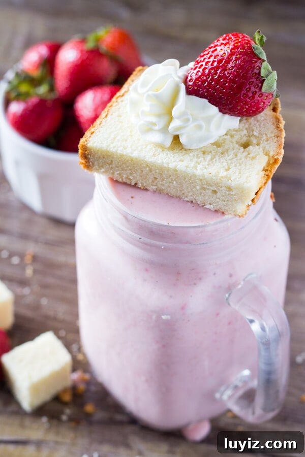Up your milkshake game with this Strawberry Shortcake Milkshake! Thick & creamy, with fresh strawberries & delicious vanilla cake - it's the perfect summer treat!