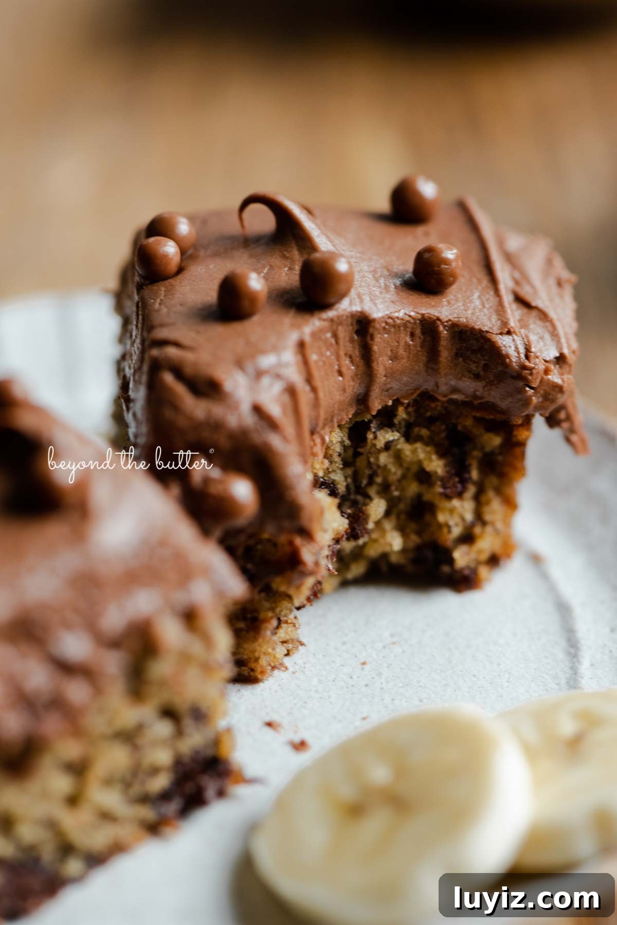 Banana Chocolate Chip Snack Cake Recipe for Quick Treats 6 Dessert plate with half eaten slices of banana snack cake