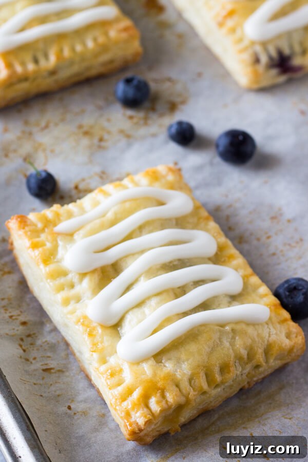 Homemade Blueberry Toaster Strudels Recipe for Flaky Breakfast 2 Buttery, flaky homemade blueberry toaster strudels with juicy blueberry centers and sweet vanilla glaze. 1000 times better than the store bought variety - learn to make them at home!