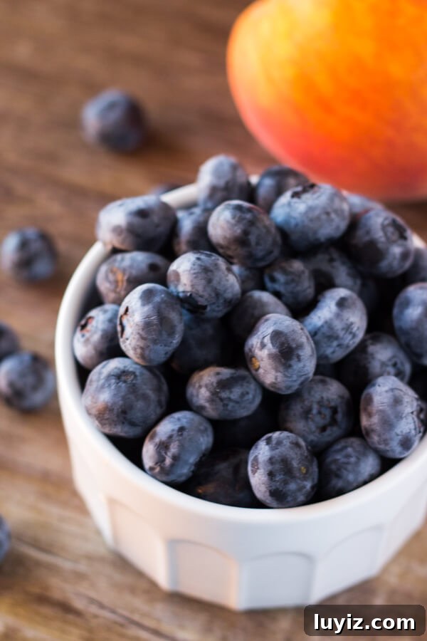 Refreshing Blueberry Peach Smoothie Recipe for Summer 3 Blueberry peach smoothie with almond milk - dairy free, naturally sweetened, 4 ingredients