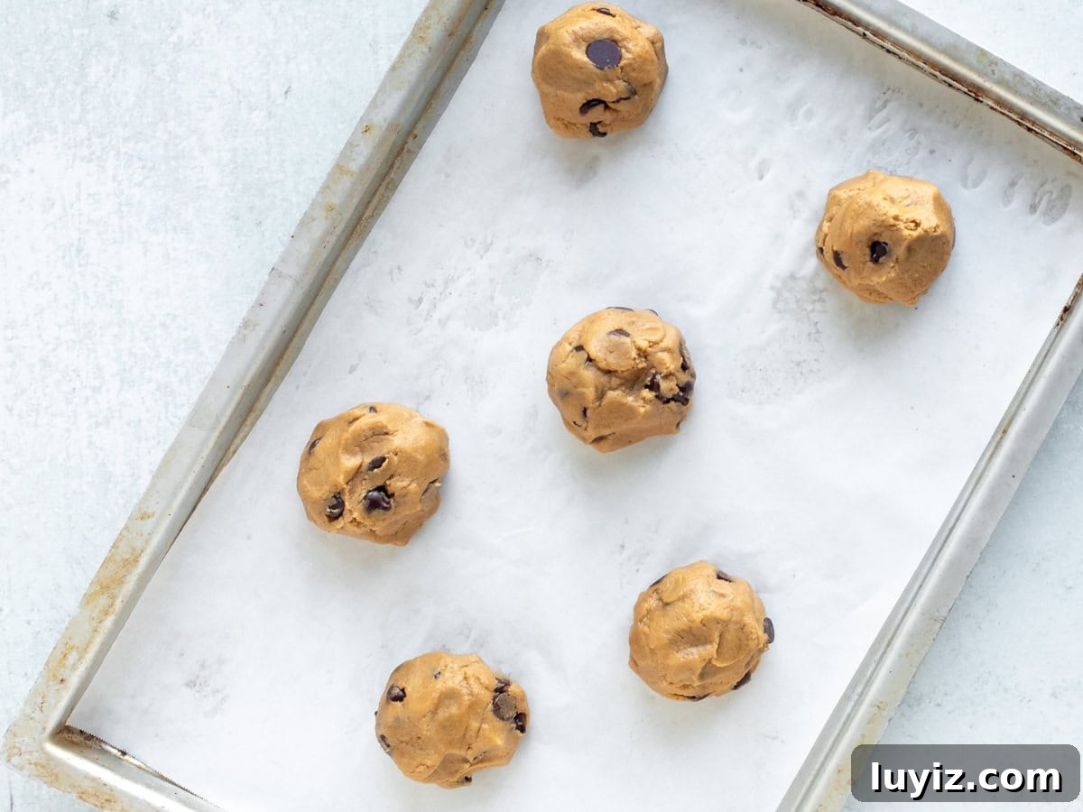 Chewy Peanut Butter Chocolate Chip Cookie Recipe 6 Cookie tray with dough balls of peanut butter chocolate chip cookies