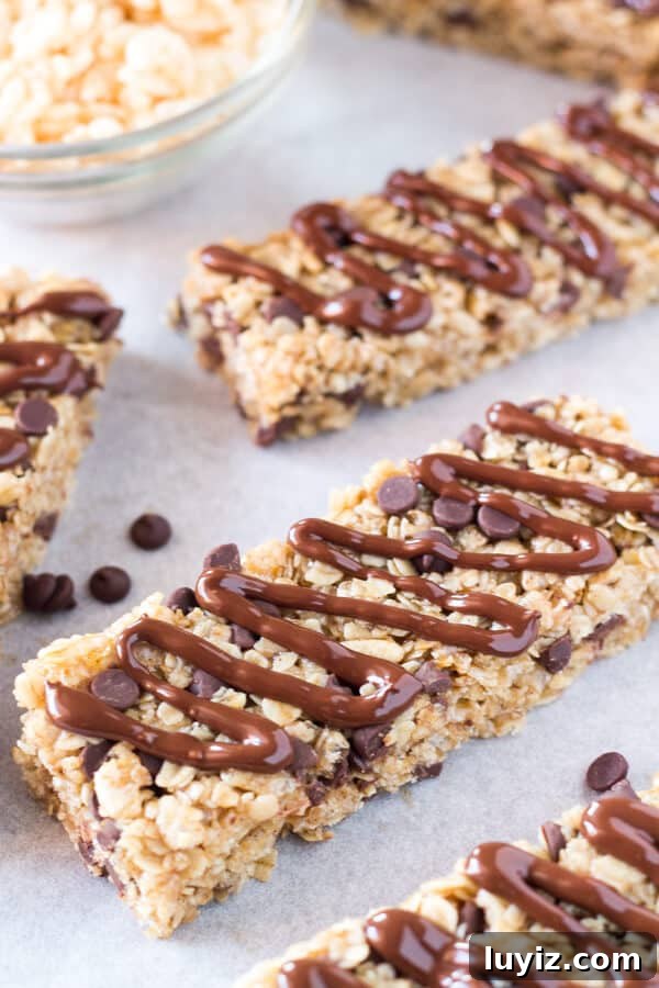 Chewy Homemade Granola Bars with Oats, Nuts & Honey 2 Soft & chewy, no bake Homemade Granola Bars with chocolate chips and chocolate drizzle. This peanut free granola bar recipe is so easy and so perfect for back to school!