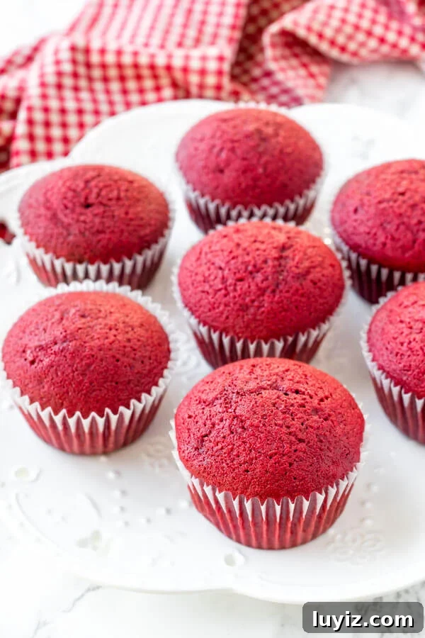 Red velvet cupcake recipe - these rise perfectly, are moist & tender with a soft crumb.