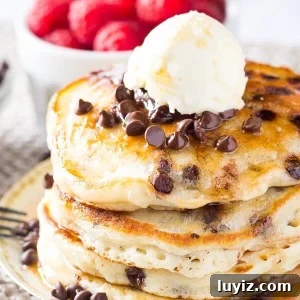 Perfectly stackable, super fluffy Chocolate Chip Pancakes. Made with buttermilk for the perfect flavor - www.justsotasty.com