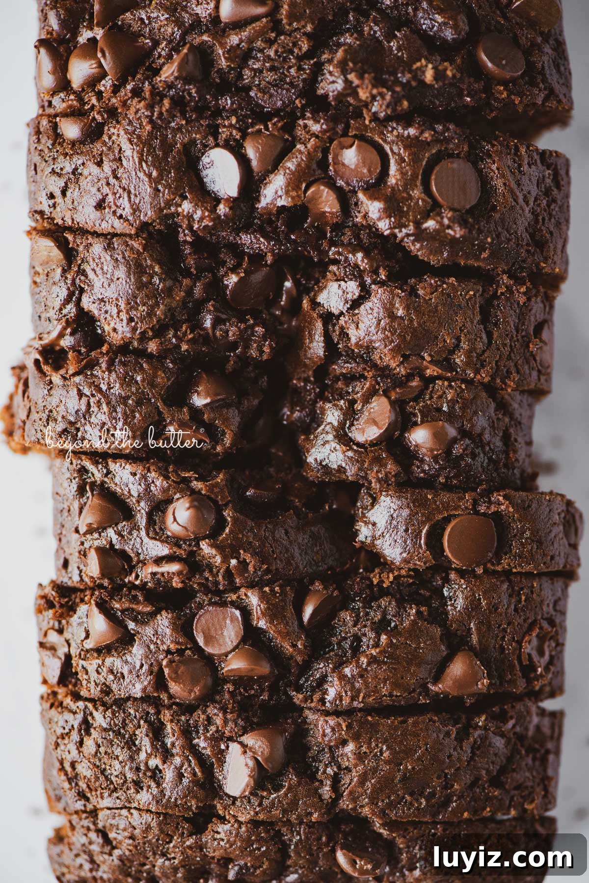 One-Bowl Chocolate Zucchini Quick Bread Recipe 9 Sliced chocolate zucchini bread | © Beyond the Butter®