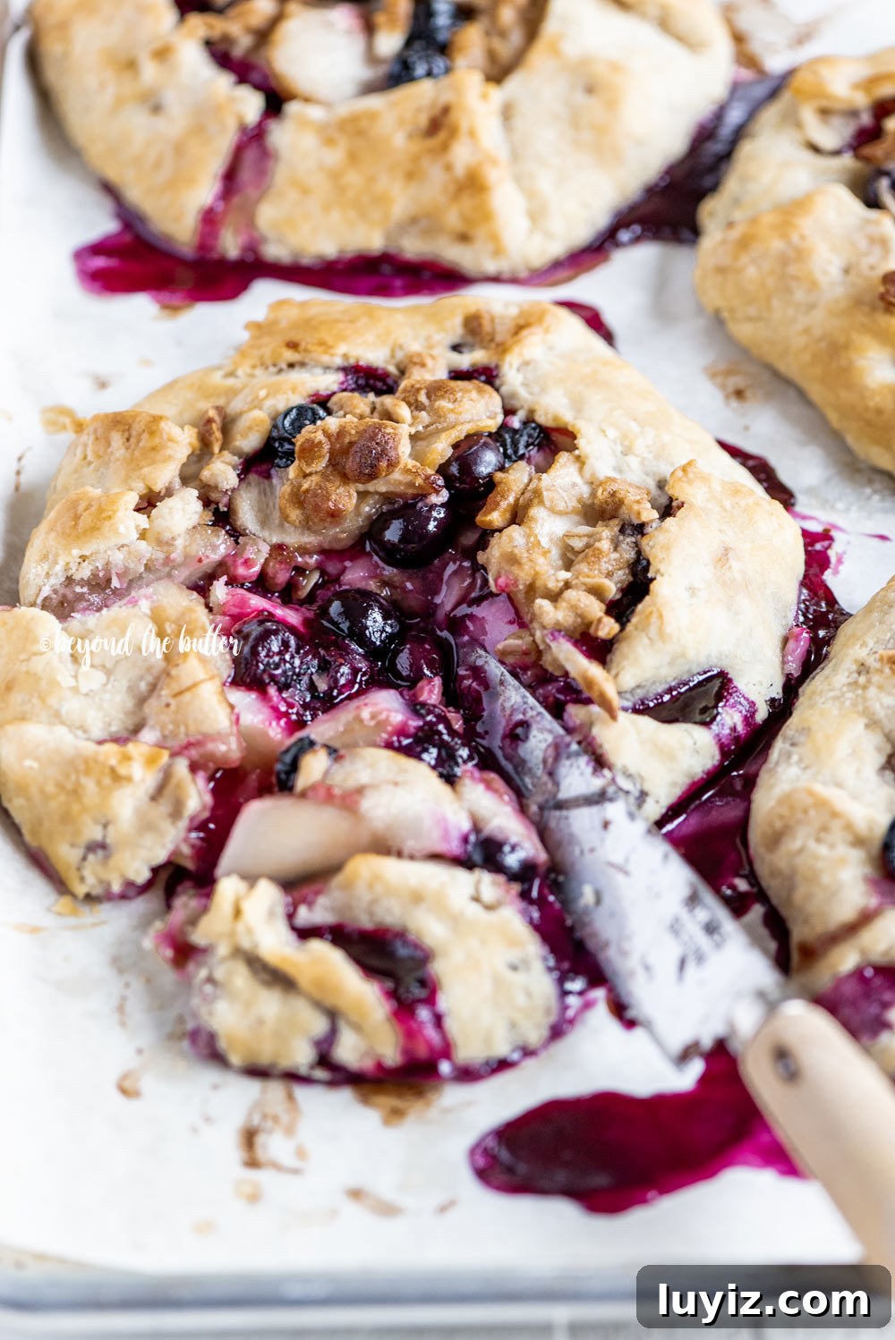 Blueberry Peach Galettes: Flaky Summer Fruit Hand Pies 8 Blueberry Peach Galettes | All Images © Beyond the Butter, LLC