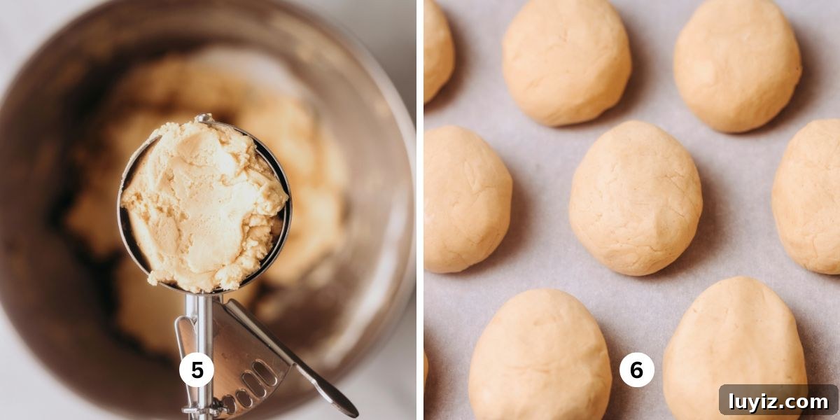 Peanut Butter Eggs Dipped in Chocolate: Homemade Candy Recipe 6 Scooping peanut butter eggs mixture into egg shapes then placing onto a wax paper lined baking sheet.