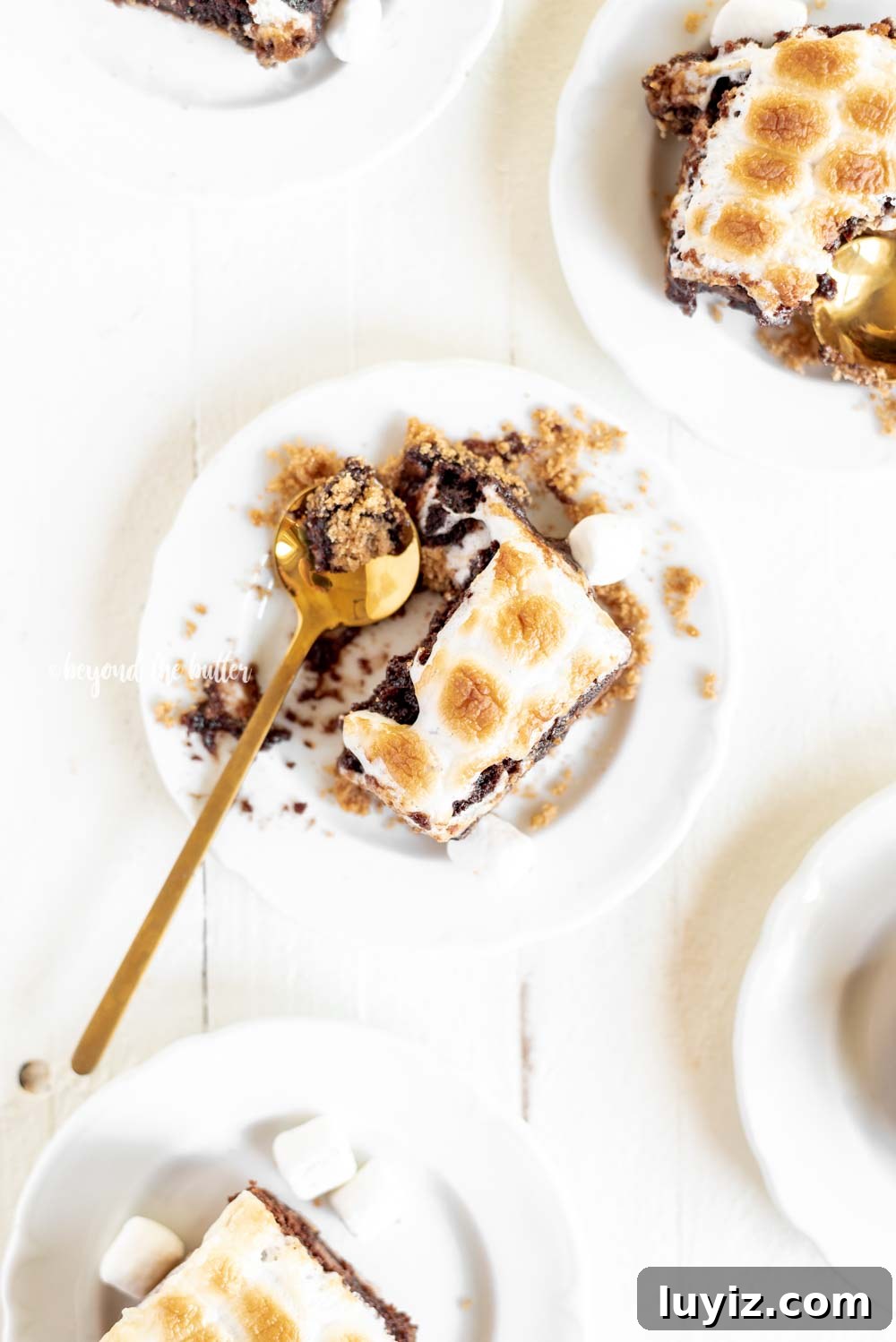 Layered S'mores Brownies Recipe: Graham, Chocolate & Toasted Marshmallow 4 Classic S'mores Brownies with graham cracker crust | All Images © Beyond the Butter, LLC
