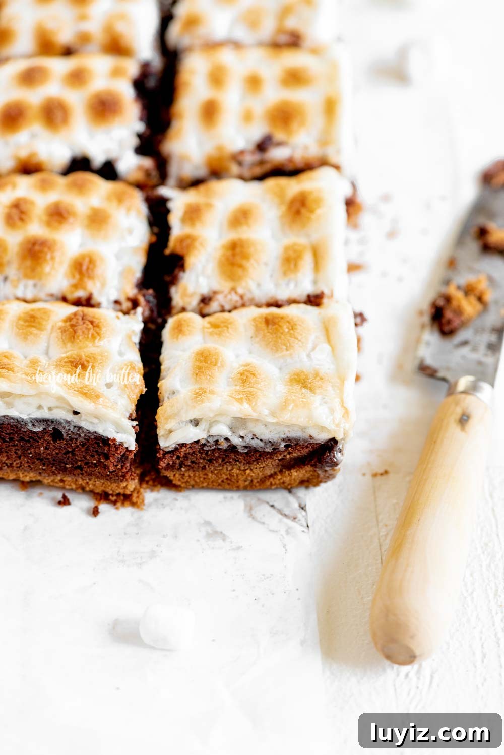 Layered S'mores Brownies Recipe: Graham, Chocolate & Toasted Marshmallow 6 Layered S'mores Brownies | All Images © Beyond the Butter, LLC