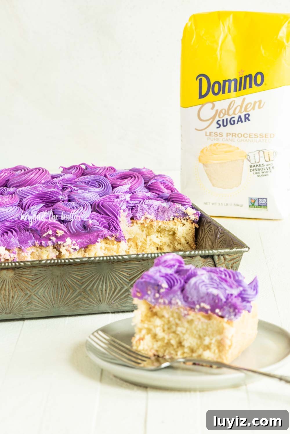 Moist Coconut Sheet Cake Recipe with Creamy Coconut Frosting 4 Coconut Sheet Cake with Coconut Buttercream Frosting | All Images © Beyond the Butter, LLC