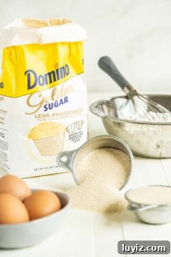 Moist Coconut Sheet Cake Recipe with Creamy Coconut Frosting 5 Domino® Golden Sugar | All Images © Beyond the Butter, LLC