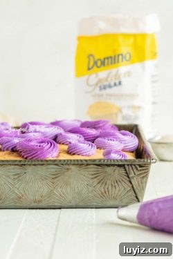 Moist Coconut Sheet Cake Recipe with Creamy Coconut Frosting 7 Coconut Sheet Cake using Domino® Golden Sugar | All Images © Beyond the Butter, LLC