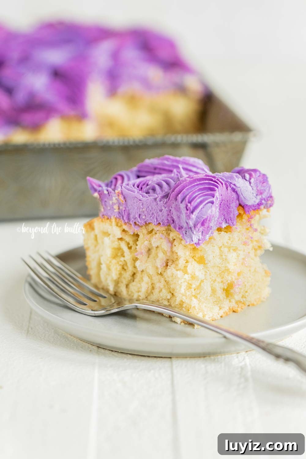 Moist Coconut Sheet Cake Recipe with Creamy Coconut Frosting 9 Easy Coconut Sheet Cake | All Images © Beyond the Butter, LLC