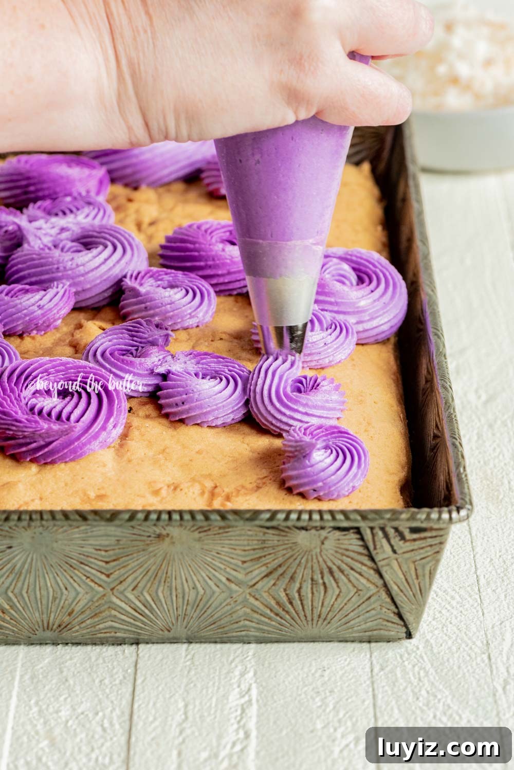 Moist Coconut Sheet Cake Recipe with Creamy Coconut Frosting 10 Coconut Sheet Cake with Coconut Buttercream Frosting | All Images © Beyond the Butter, LLC