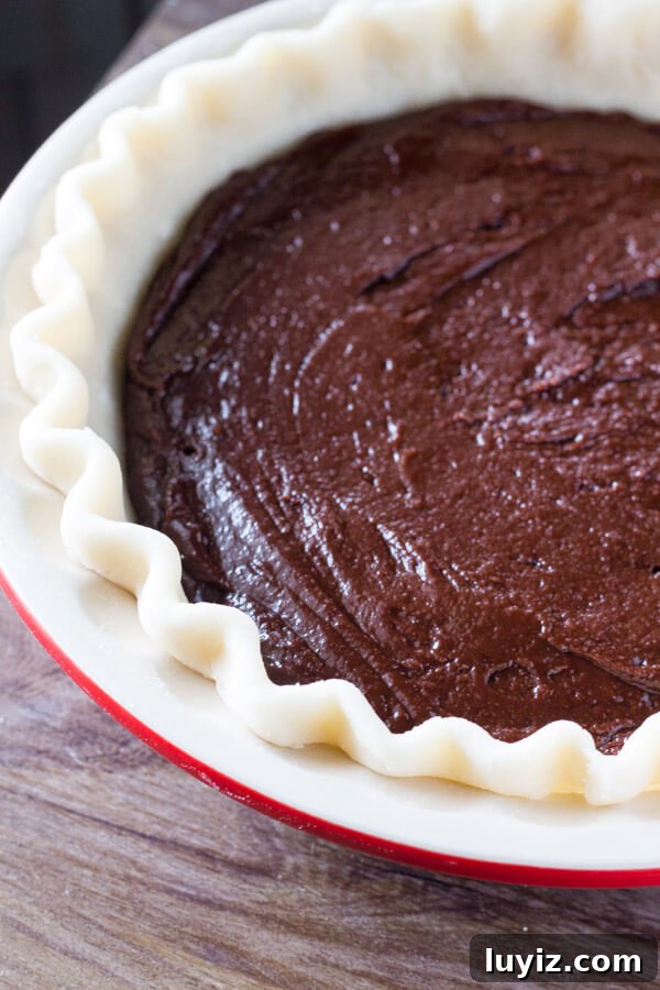 Fudge Brownie Pie Recipe — Decadent Chocolate Pie You'll Love 5 This easy, homemade Fudge Brownie Pie features a flaky, golden pie crust shell filled with the gooiest, fudgiest brownie. Serve it with ice cream & caramel sauce for the ultimate treat!