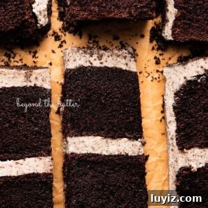 Decadent Chocolate Cake with Oreo Buttercream Frosting 20 Slices of three layer chocolate cake with oreo buttercream frosting on natural parchment paper.