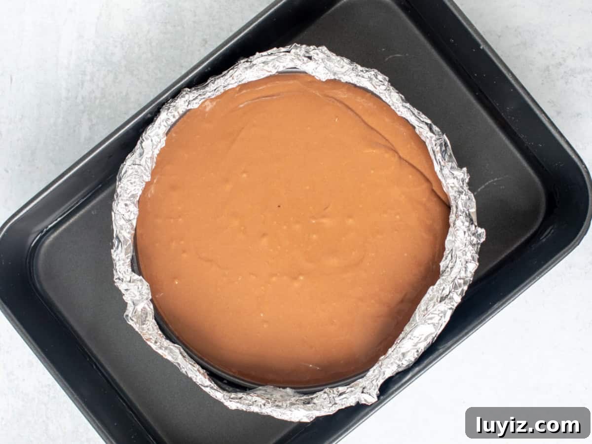 Decadent Chocolate Cheesecake Recipe: Creamy, Rich & Fudgy 7 Springform pan in water bath