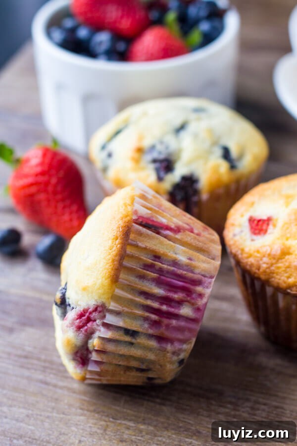 Triple Berry Muffins Recipe with Fresh Strawberries, Blueberries & Raspberries 3 Triple Berry Muffins. Moist, fluffy, buttery & bursting with berries - make them with fresh or frozen fruit - they're always a hit! www.justsotasty.com