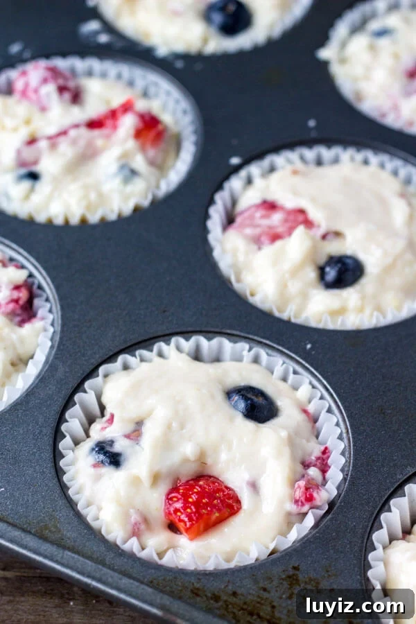 Triple Berry Muffins Recipe with Fresh Strawberries, Blueberries & Raspberries 5 Triple Berry Muffins. Moist, fluffy, buttery & bursting with berries - make them with fresh or frozen fruit - they're always a hit! www.justsotasty.com