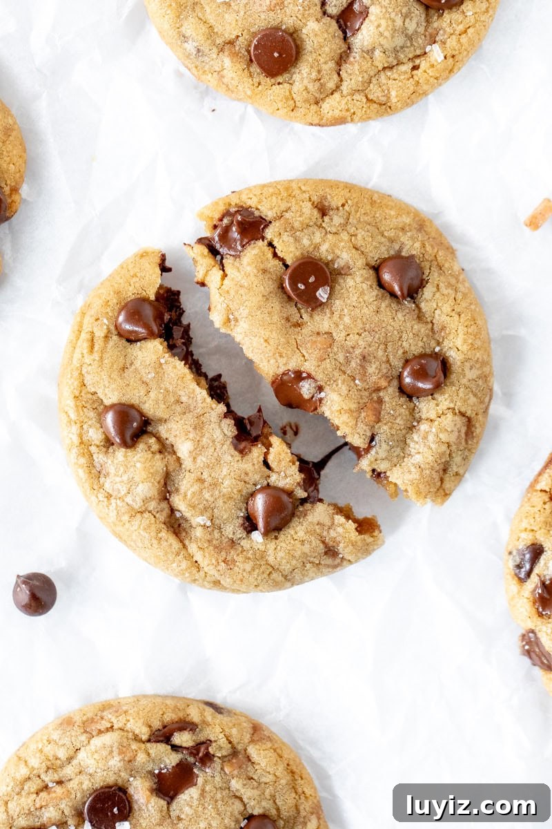 Brown Butter Toffee Chocolate Chip Cookies — Crispy & Gooey 2 Brown butter chocolate chip cookie broken in half