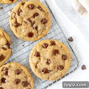 Brown Butter Toffee Chocolate Chip Cookies — Crispy & Gooey 11 brown butter toffee chocolate chip cookies on a cooling rack