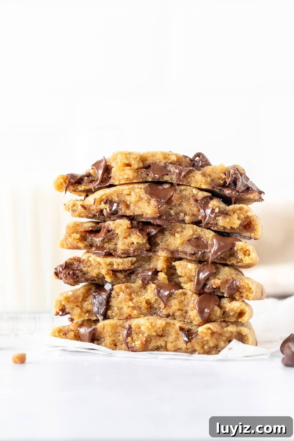 Brown Butter Toffee Chocolate Chip Cookies — Crispy & Gooey 4 Stack of toffe brown butter chocolate chip cookies, broken in half
