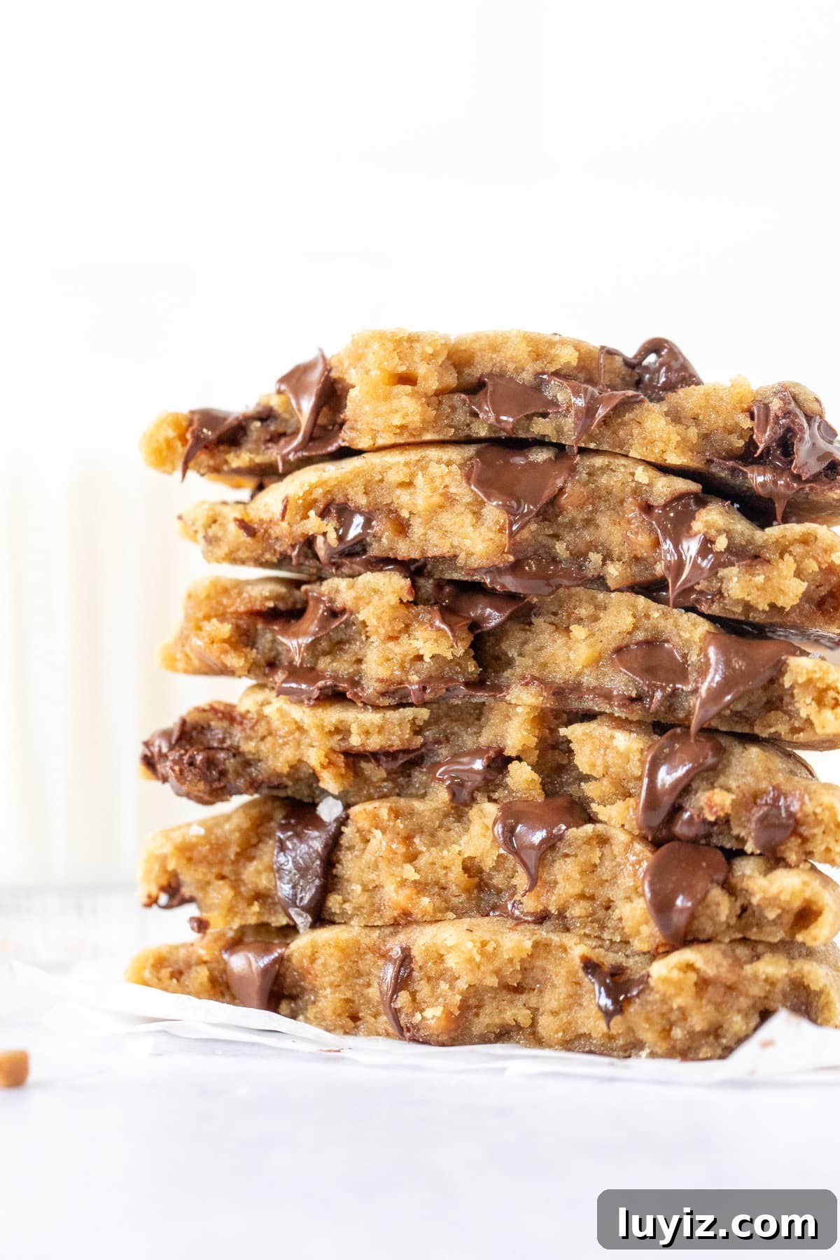 Brown Butter Toffee Chocolate Chip Cookies — Crispy & Gooey 10 Stack of chocolate chip cookie halves oozing with chocolate chips
