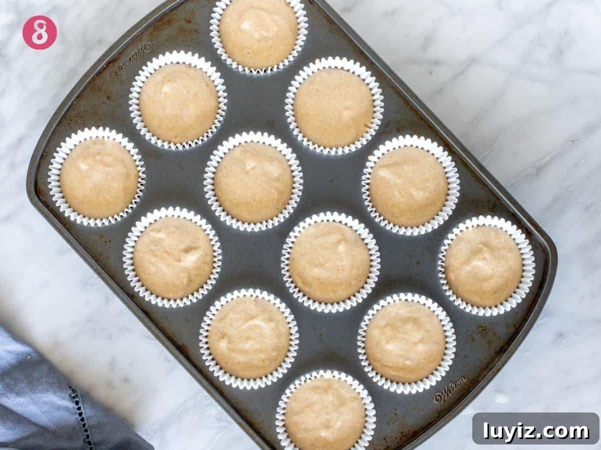 Banana Cupcakes with Cream Cheese Frosting Recipe 8 Muffin tray with cupcake liners filled with batter