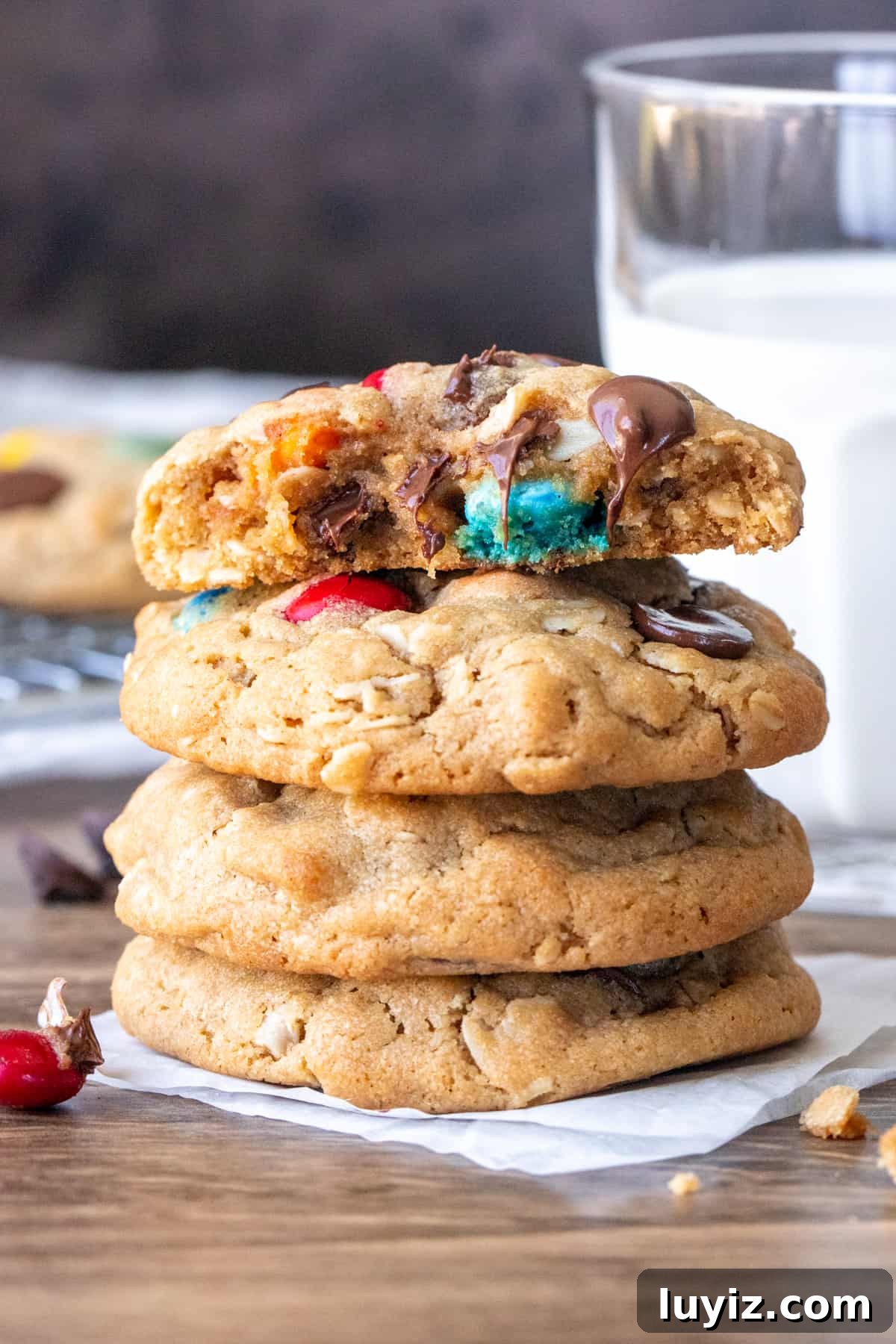 Soft, Chewy Monster Cookie Recipe for Ultimate Cookie Lovers 7 Stack of monster cookies with top cookie broken in half