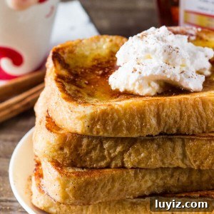 Eggnog French Toast. Fluffy, buttery, with golden edges, a hint of nutmeg and delicious eggnog flavor. The perfect easy breakfast for the holidays! www.justsotasty.com