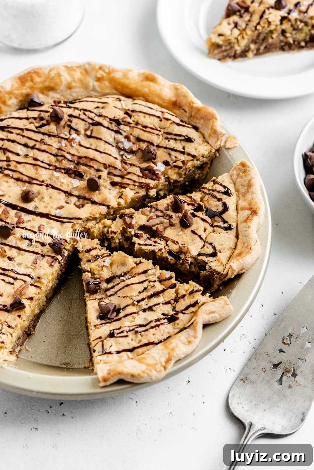Ultimate Chocolate Chip Pie Recipe: Gooey, Crispy, and Irresistible 6 Overhead angled image of chocolate chip pie with 2 slices cut