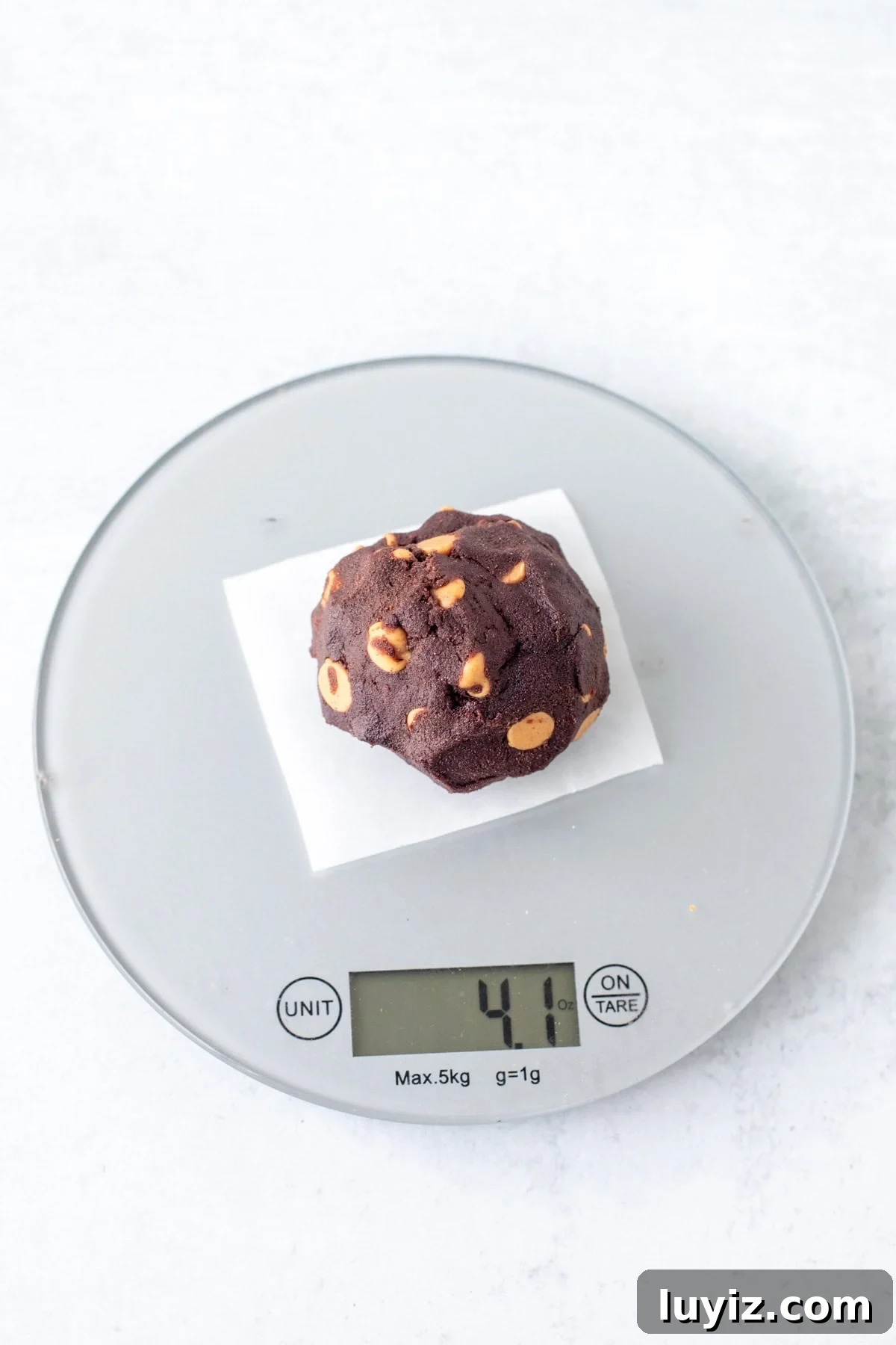 Dark Chocolate Peanut Butter Chip Cookies Recipe for Decadent Treats 4 Dark chocolate cookie dough ball on a baking scale