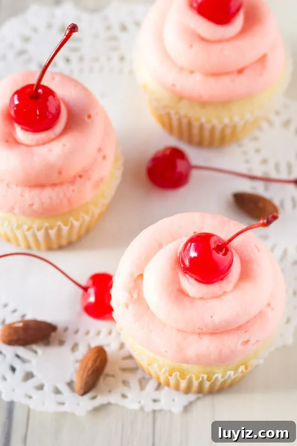 Cherry Almond Cupcakes Recipe with Cherry Glaze 3 Cherry Almond Cupcakes. Fluffy, moist, super soft almond cupcakes topped with maraschino cherry frosting. www.justsotasty.com