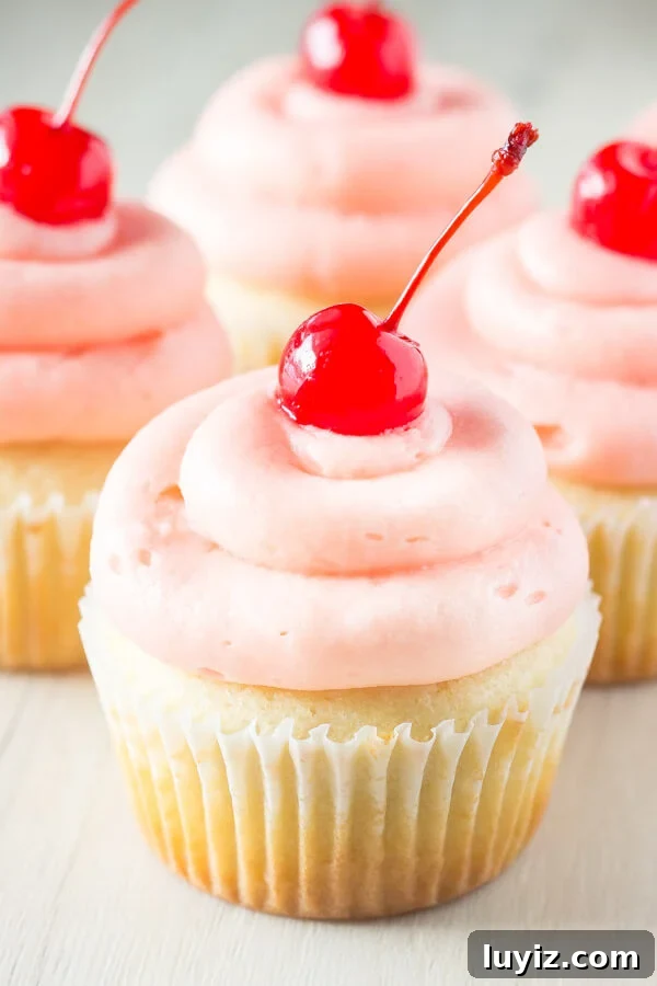 Cherry Almond Cupcakes Recipe with Cherry Glaze 5 Cherry Almond Cupcakes. Fluffy, moist, super soft almond cupcakes topped with maraschino cherry frosting. www.justsotasty.com