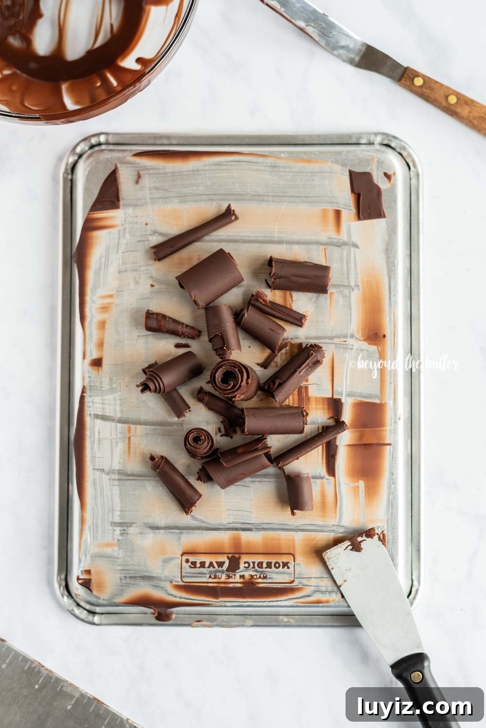 Perfect Chocolate Curls: Step-by-Step Guide for Stunning Garnishes 3 How to Make Chocolate Curls | All Images and Video © Beyond the Butter, LLC
