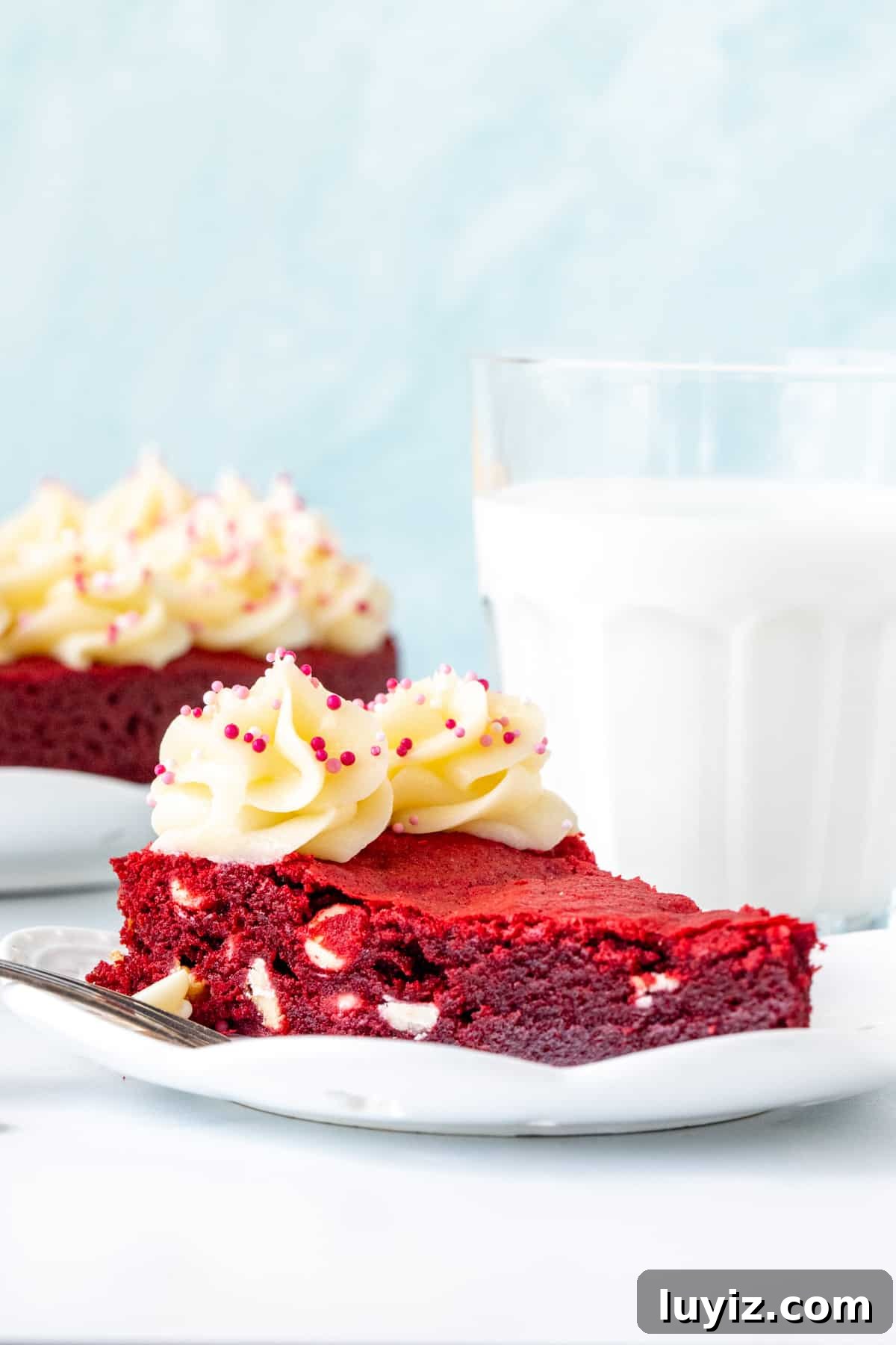 Red Velvet Cookie Cake Recipe: Decadent Layered Dessert Guide 2 Slice of red velvet cookie cake with cream cheese frosting