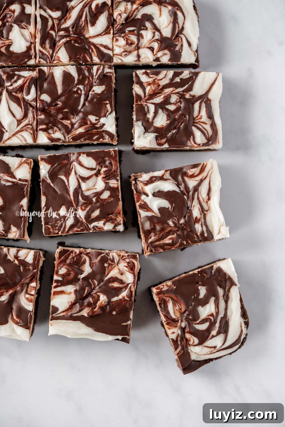 Peppermint Chocolate Swirl Brownies — Festive Fudgy Recipe 4 Squares of Chocolate Peppermint Swirled Brownies | All Images © Beyond the Butter, LLC