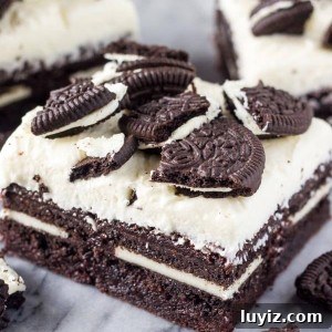 Marshmallow Oreo Brownies Recipe — Gooey Chocolate Cookie Bars 6 Marshmallow Oreo Brownies. Fudgy brownies stuffed with Oreo cookies, and topped with fluffy marshmallow frosting and more Oreo cookies. www.justsotasty.com