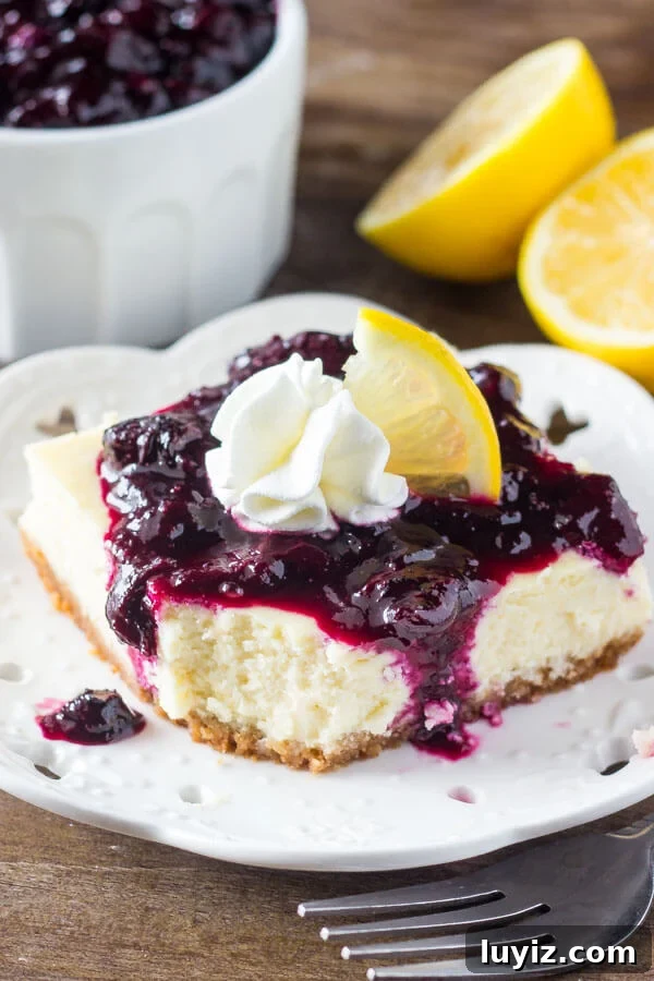 Lemon Blueberry Cheesecake Bars — Bright Summer Dessert Recipe 4 Lemon Blueberry Cheesecake Squares. Smooth & creamy lemon cheesecake with a graham cracker crust and blueberry sauce. Perfect for spring!