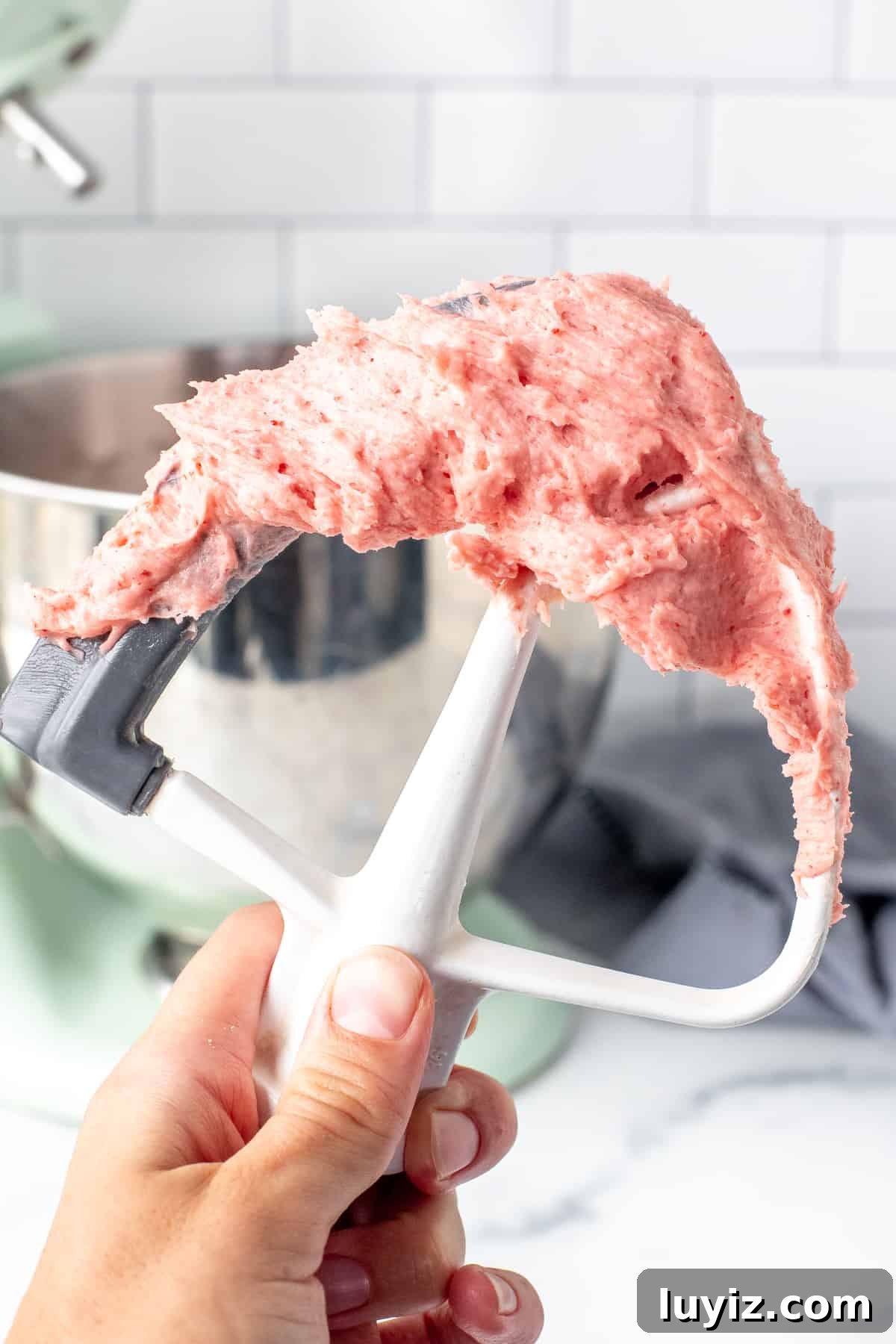 Strawberry Buttercream Frosting Made with Fresh or Frozen Berries 6 Strawberry frosting on electric beater