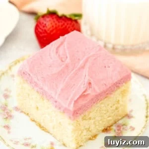 Vanilla Layer Cake with Strawberry Buttercream Frosting 6 Slice of vanilla cake with strawberry frosting