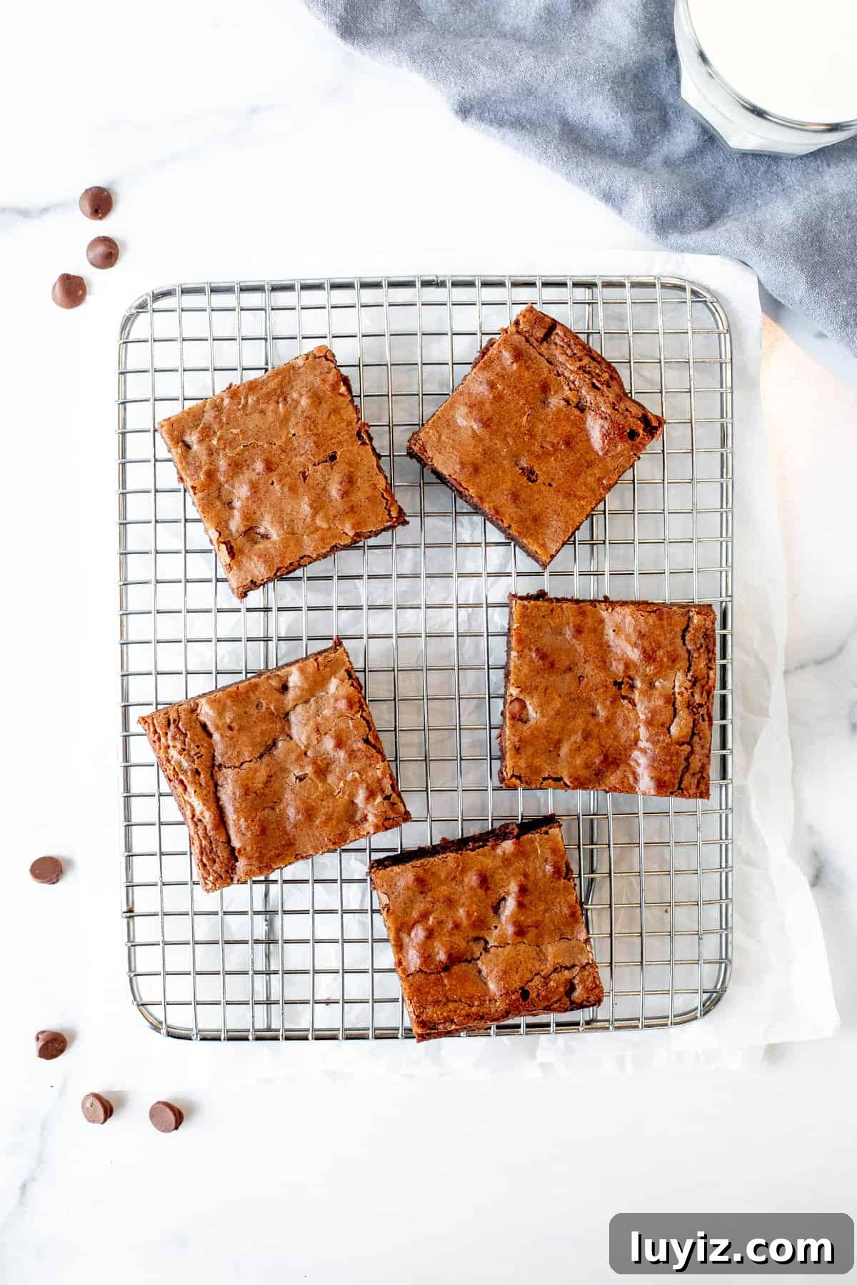 Decadent Milk Chocolate Brownies Recipe — Rich, Gooey Squares 7 5 milk chocolate brownies on a cooling rack