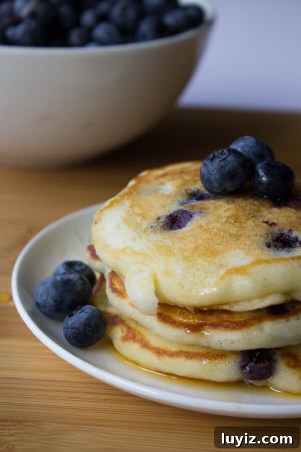 Blueberry Buttermilk Pancakes Recipe for Fluffy Homemade Pancakes 2 Blueberry Buttermilk Pancakes. Light, fluffy and bursting with blueberries - these pancakes are so much better than any mix! www.justsotasty.com