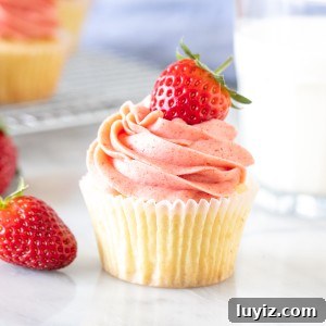 Vanilla Cupcakes with Fresh Strawberry Buttercream Frosting 7 Vanilla cupcake with strawberry frosting and a glass of milk