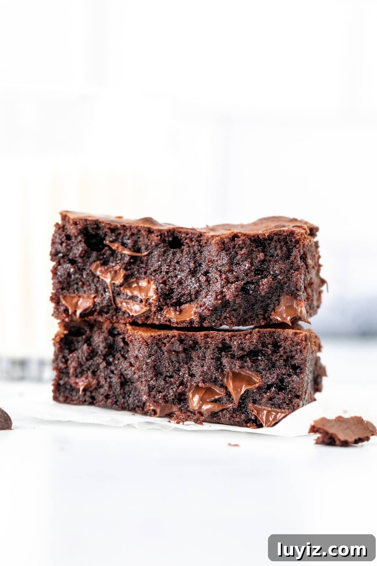 One-Bowl Chewy Fudge Brownies Recipe 6 One chewy brownie broken in half, with brownie halves stacked on top of each other