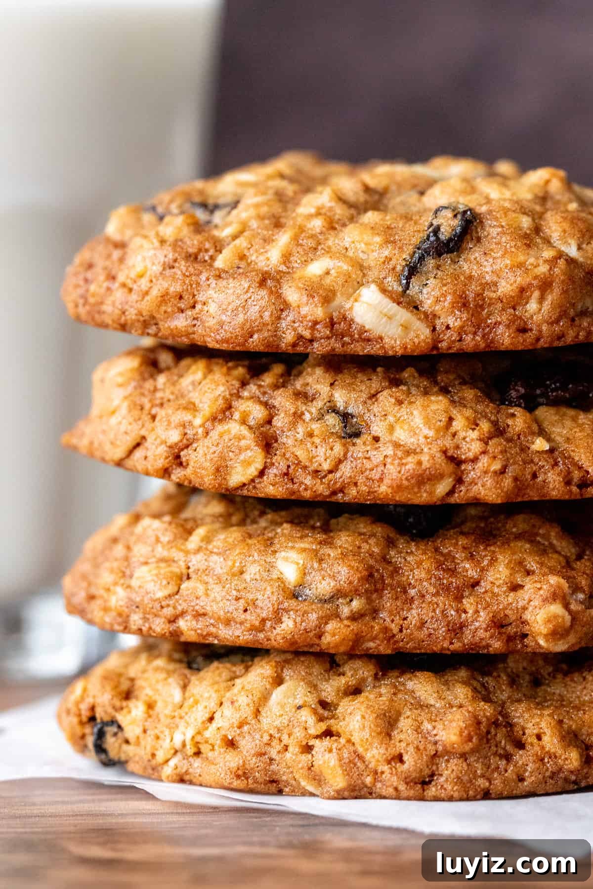 Chewy Oatmeal Raisin Cookie Recipe That Bakes Perfectly Every Time 2 Stack of oatmeal raisin cookies with glass of milk