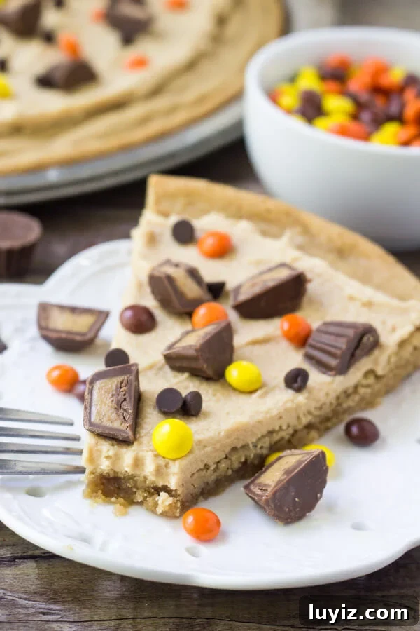 Peanut Butter Cookie Pizza Recipe: How to Make a Decadent Dessert Pizza 5 Slice of peanut butter cookie pizza with a soft and chewy peanut butter cookie base, peanut butter frosting and peanut butter candies.