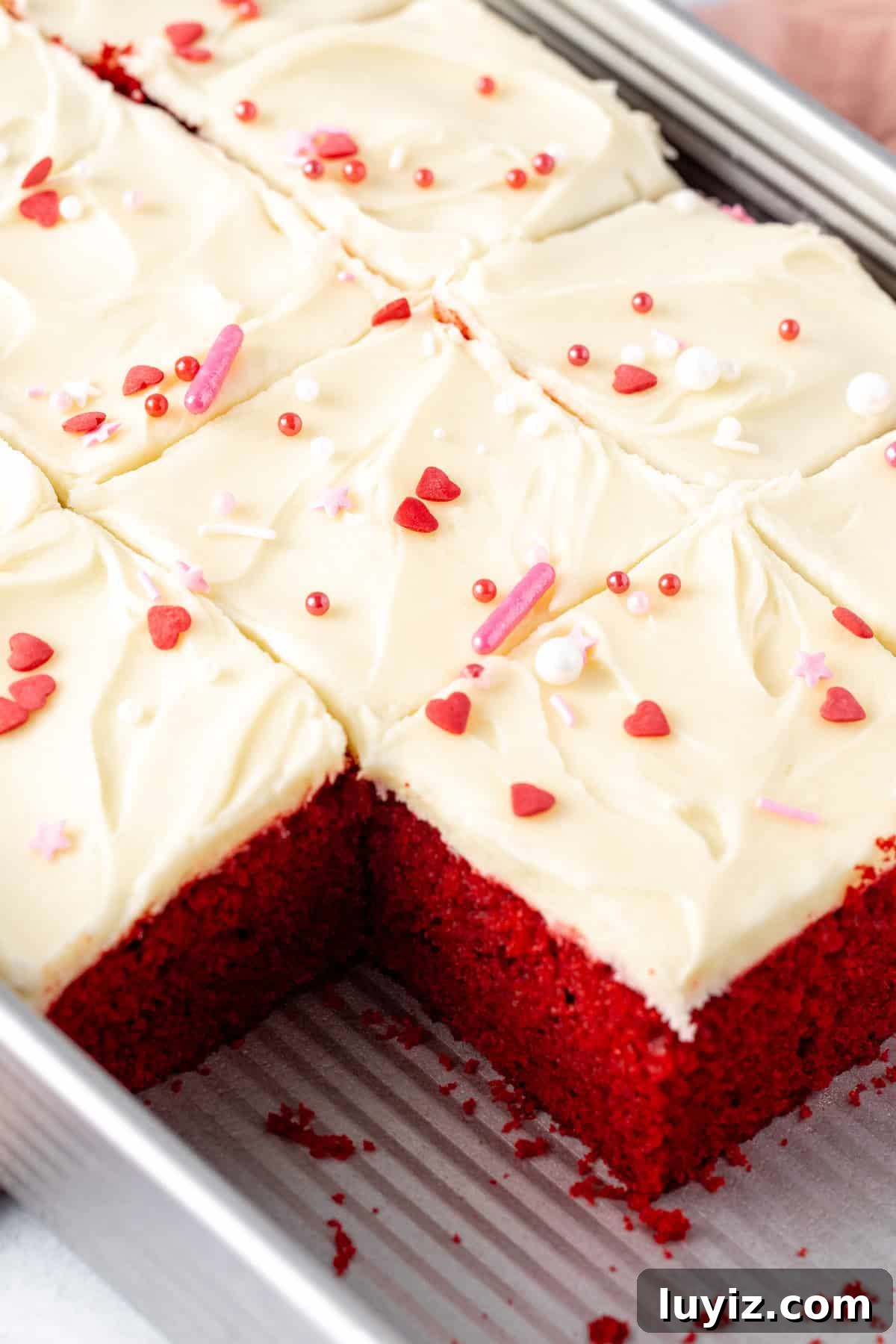 Classic Red Velvet Cake Recipe for Moist, Perfect Layers 11 Pan of red velvet sheet cake topped with cream cheese frosting